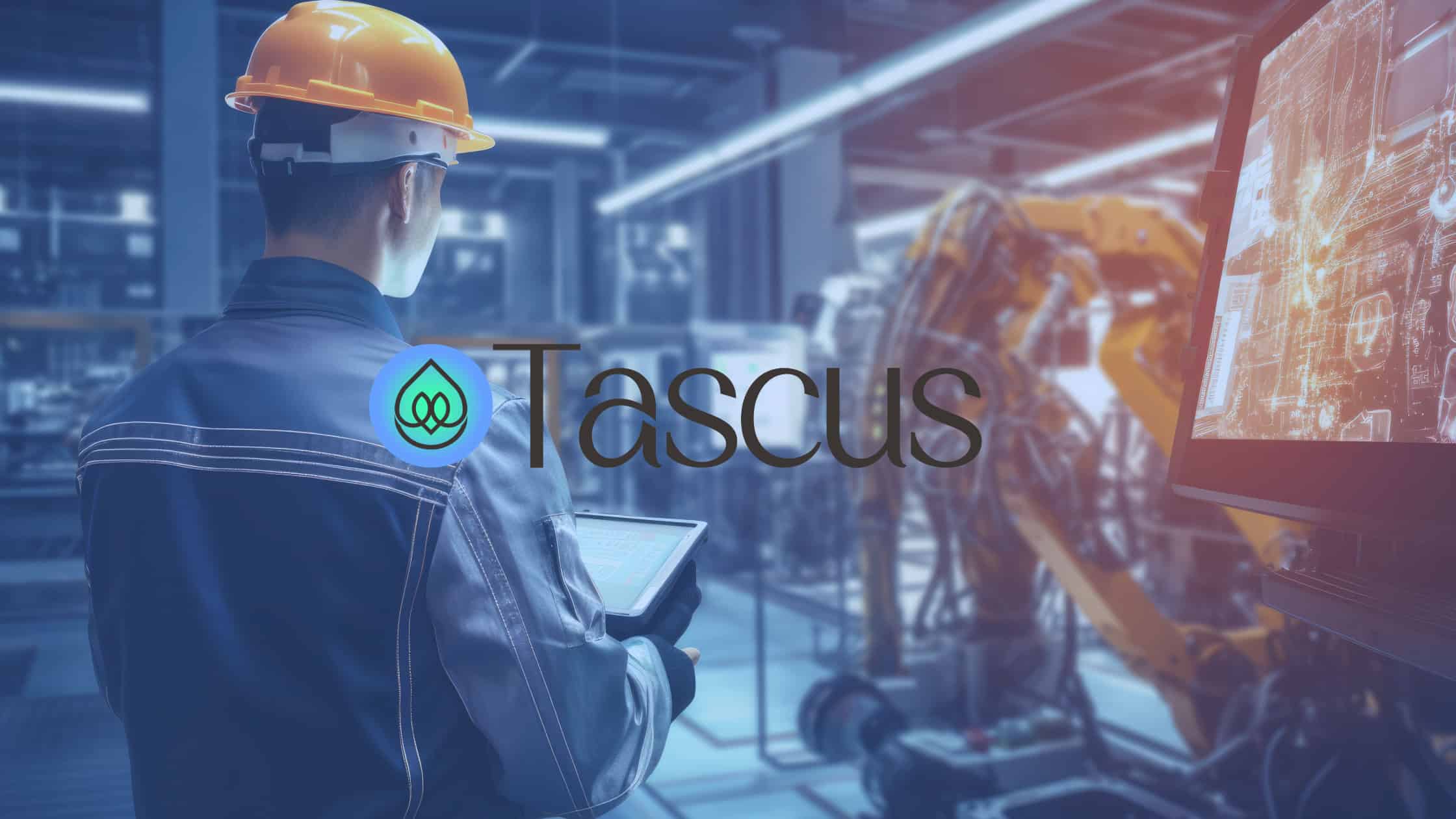 007 Metis POV Featured Image A manufacturing engineer wearing a hard hat and holding a tablet, overseeing an advanced factory floor equipped with automated machinery and digital monitors, representing the efficiency and innovation enabled by Tascus MES.